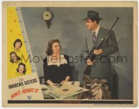 9y546 HOW'S ABOUT IT LC 1943 Mary Wickes looks surprised at Robert Paige holding rifle in office!