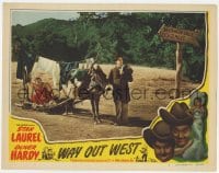 9y951 WAY OUT WEST LC #7 R1947 Stan Laurel leads mule dragging Oliver Hardy wearing a towel!