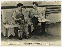 1a605 MODERN TIMES deluxe 7x9.25 still 1936 Charlie Chaplin staring at big guy with big lunch box!