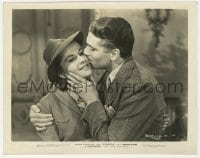 1a715 REBECCA 8x10.25 still 1940 c/u of Laurence Olivier kissing Joan Fontaine's cheek, Hitchcock!