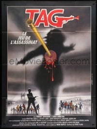 1c931 TAG: THE ASSASSINATION GAME French 1p 1983 Landi art of bloody dart hitting silhouette!