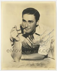 1h346 ERROL FLYNN signed deluxe 8x10 still 1930s great close up of the leading man smoking pipe!