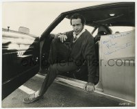 1h542 WARREN OATES signed 7.75x9.75 still 1971 close up getting out of car in Two-Lane Blacktop!