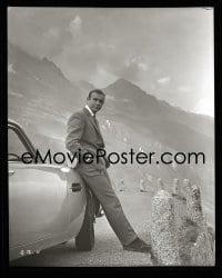 1x063 GOLDFINGER 8x10 negative 1964 Sean Connery as James Bond leaning on his Aston Martin DB5!