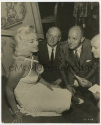 2a221 DIANA DORS 7.5x9.5 still 1956 meeting the attentive American press in skimpy outfit!