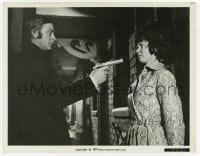2a339 GET CARTER 8x10.25 still 1971 c/u of Michael Caine uses gun to force Dorothy White to go!