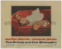 2m364 PRINCE & THE SHOWGIRL LC #6 1957 sexiest Marilyn Monroe smiling on red couch in feathers!