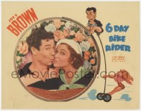 3b343 6 DAY BIKE RIDER LC 1934 close up of Joe E. Brown kissing Maxine Doyle, cool border art!