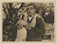 3b609 TROUBLE SHOOTER LC 1924 great close up of shocked Tom Mix receiving a kiss from pretty girl!
