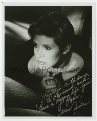3d779 CARRIE FISHER signed 8x10 REPRO still 1983 great close portrait clutching chest in shadows!