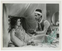 3d930 MYRNA LOY signed 8.25x10 REPRO still 1980s in bed staring at Ramon Novarro in The Barbarian!