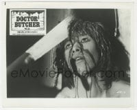 3h246 DOCTOR BUTCHER M.D. 8x10 still 1981 gruesome image of machete stuck in man's skull!