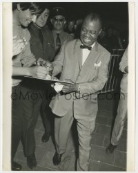 3h560 LOUIS ARMSTRONG 8x10.25 still 1940s the legendary musician signing autographs for his fans!