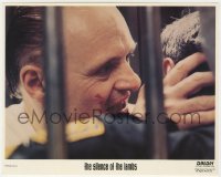 3h058 SILENCE OF THE LAMBS 8x10 mini LC 1991 Anthony Hopkins as Hannibal eating guard's face!