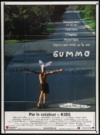 3w668 GUMMO French 1p 1997 wacky image of half-naked man on skateboard & wearing bunny hat!