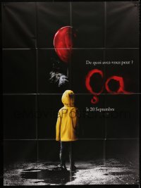 3w719 IT teaser French 1p 2017 creepy image of Pennywise handing child balloon from the shadows!