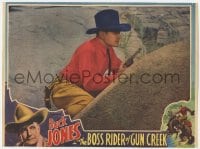 4a270 BOSS RIDER OF GUN CREEK LC 1936 close up of Buck Jones with gun drawn hiding behind boulder!