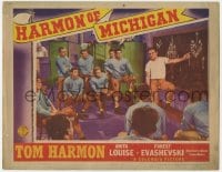 4a496 HARMON OF MICHIGAN LC 1941 the Wolverine football star going over strategy in locker room!
