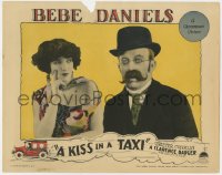 4a575 KISS IN A TAXI LC 1927 close up of sexy Bebe Daniels staring at wacky Chester Conklin!
