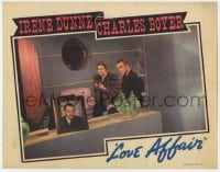 4a611 LOVE AFFAIR LC 1939 Charles Boyer is bothered by picture of another man in Irene Dunne's room