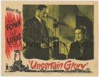 4a939 UNCERTAIN GLORY LC 1944 close up of Paul Lukas holding gun & looking down at Errol Flynn!