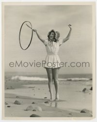 4d129 ANN RUTHERFORD  8x10 still 1940 at beach playing a new game that involves twirling a hoop!