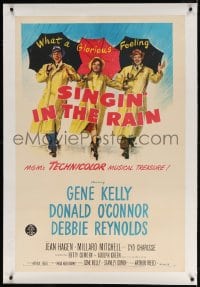 4h348 SINGIN' IN THE RAIN linen 1sh 1952 best art of Gene Kelly, Donald O'Connor & Debbie Reynolds!