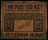 4s065 MASTER KEY 7x8 stamp album 1914 early serial, contains 63 stamps with scenes from the movie!