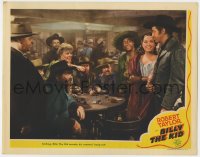 5b218 BILLY THE KID LC 1941 outlaw Robert Taylor invades his enemies' hang-out while smiling!