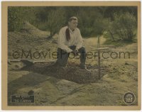 5w451 FUGITIVE LC 1925 close up of cowboy Ben Wilson saying a prayer over a grave he just dug!