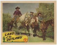 5w545 LAND OF THE OUTLAWS LC 1944 close up of cowboys Johnny Mack Brown & Raymond Hatton on horses!