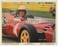6b229 YVES MONTAND signed color 8x10 still #15 1967 great c/u in his race car in Grand Prix!