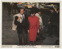 6h051 BREAKFAST AT TIFFANY'S color 8x10 still 1961 Audrey Hepburn & Peppard holding hands on street!