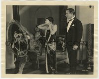 6h653 MY AMERICAN WIFE 8x10 still 1922 Gloria Swanson checks her makeup in mirror held by native!
