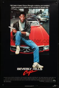 6r549 BEVERLY HILLS COP 1sh 1984 great image of detective Eddie Murphy sitting on red Mercedes!