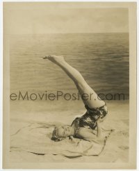 7f570 KAY WILLIAMS 8.25x10.25 still 1940s sexy swimsuit portrait lifting her legs by the ocean!