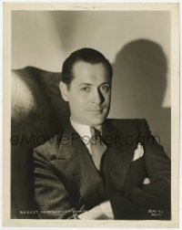 7f790 ROBERT MONTGOMERY 8x10.25 still 1930s MGM studio portrait seated with his arms crossed!