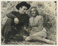 7h263 LADY TAKES A CHANCE deluxe 10.75x13.75 still 1943 Jean Arthur & John Wayne on hay by Miehle!