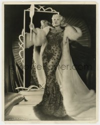 7h289 MAE WEST 11x14 still 1930s sexy full-length portrait in gown & fur cape by mirror!