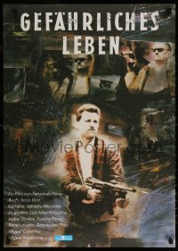 7j176 CLANDESTINOS East German 23x32 1988 Fernando Perez, cool image of man with machine gun!