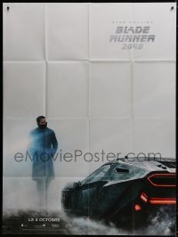 8b648 BLADE RUNNER 2049 teaser French 1p 2017 cool image of Ryan Gosling standing by car!