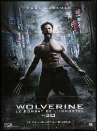 8b988 WOLVERINE teaser French 1p 2013 Hugh Jackman as Logan kneeling with his claws extended!