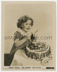 8g830 SHIRLEY TEMPLE 8x10.25 still 1935 on her 7th birthday posing by her cake with a big smile!