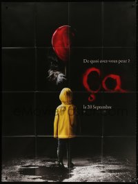 9f777 IT teaser French 1p 2017 creepy image of Pennywise handing child balloon from the shadows!