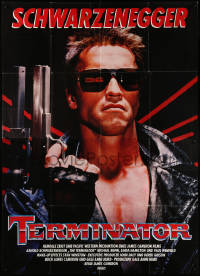 9j180 TERMINATOR German 2p 1985 close up of most classic cyborg Arnold Schwarzenegger with gun!