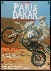 9j363 RALLYE PARIS DAKAR German 1984 completely different image of motorcyclist popping a wheelie!