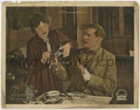 9k513 HOSTAGE LC 1917 Dorothy Abril tries to give medicine to Wallace Reid, but he resists!