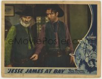 9k552 JESSE JAMES AT BAY LC 1941 c/u of scruffy Roy Rogers & Gabby Hayes looking at the ground!