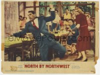 9k683 NORTH BY NORTHWEST LC #8 1959 Alfred Hitchcock, Eva Marie Saint shoots at Cary Grant in cafe!