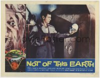 9k684 NOT OF THIS EARTH LC 1957 Roger Corman classic, close up of Jonathan Haze examining skull!